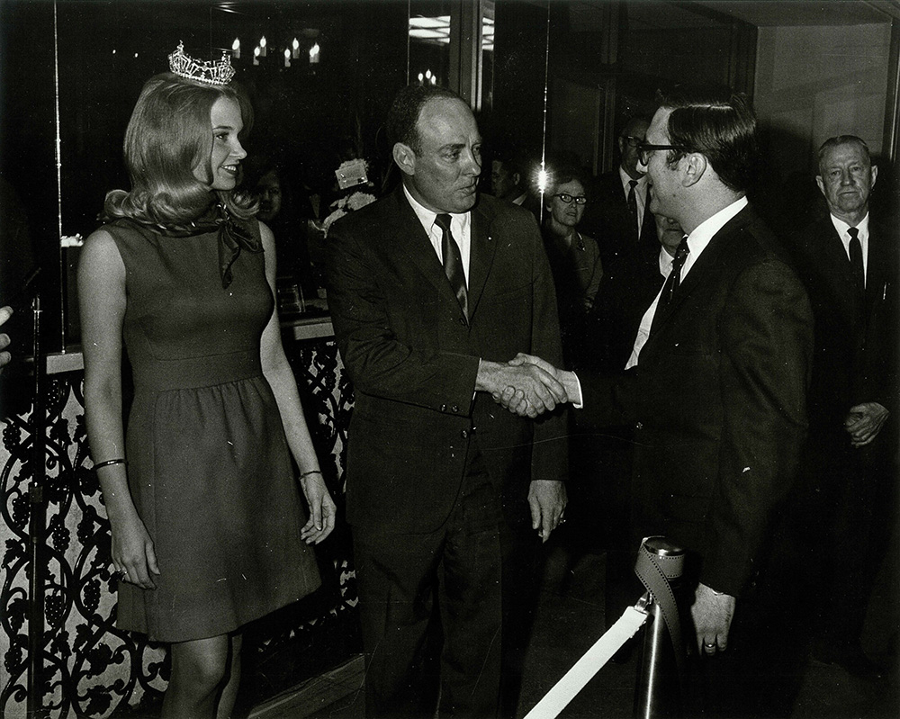 People greeting each other inside lobby 1968